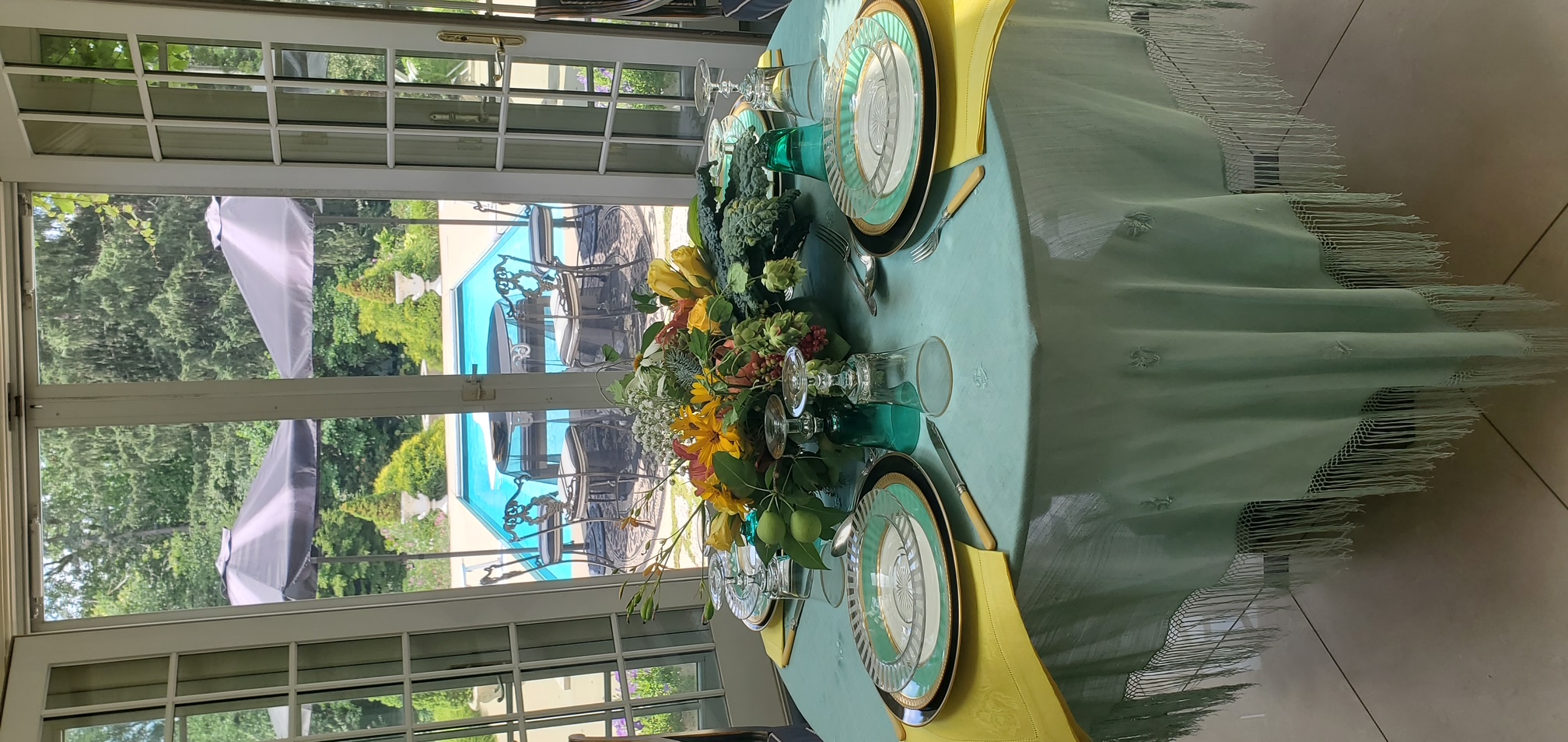 Aqua table setting facing pool